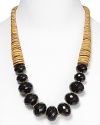 Tribal-inspired chic from RJ Graziano. This bold necklace marries graduated tan stone discs with multifaceted black beads for a versatile piece that works with a dress or dark jeans.