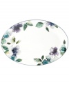 Watercolor florals adorn the canvas of white porcelain that is Mikasa's Paradise Bloom oval platter. A simple silhouette and band of blue complete this essential part of the everyday dinnerware collection.