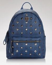 The ever-easy backpack gets a shot of glam in this stunning, studded style from MCM. Crafted of coated canvas and splashed with the label's motif, it's a total throwback.