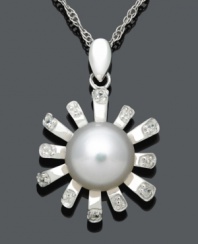 Freshen your look in sweet floral style. This chic pendant features diamond-accented petals, a cultured freshwater pearl center (8-9 mm), and a sterling silver setting. Approximate length: 18 inches. Approximate drop: 7/8 inch.