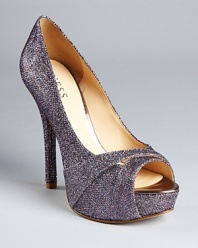 GUESS adds some flash to a glitter fabric open toe platform pump that will get noticed your next night out. It's party time!