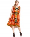 Calvin Klein's plus size dress features a vibrant tribal-inspired print and a flattering fit thanks to a tie belt that lends the bodice a blouson-like effect.
