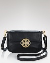 A bright gold tone logo gleams on this petite leather bag, featuring a removable crossbody strap. By Tory Burch.
