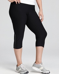 These workout-ready Nike leggings feature cooling mesh panels, reflective strips, and Dri-FIT technology to wick away moisture.