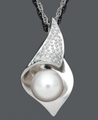 Smooth, delicate, and elegant. This timeless style combines a shimmery cultured freshwater pearl (7-8 mm), sparkling diamond accents and a sterling silver setting. Approximate length: 18 inches. Approximate drop: 9/10 inch.