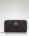Tory Burch goes continental with this luxe, logo-topped Saffiano wallet.