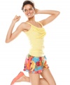 Have a sunny and fun day in Jenni's yellow tank and boxers set. The yellow tank features a pretty ruffle detail in the front while the comfy shorts feature a bright tropical print and an elastic waistband with drawstring.