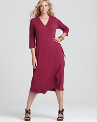 A jewel-tone palette breathes distinctive life into an Eileen Fisher Plus wrap dress, finished with an angled hem for a strikingly modern silhouette.