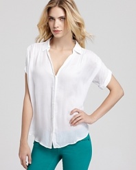 A versatile go-with-all, this sheer Aqua button-down top pairs with color denim for cool-girl weekend style.