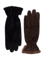 Seal in warmth for winter. The elasticized cuffs of these sumptuous suede gloves by Isotoner keep the microluxe lining close and cozy.