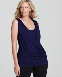 A rippling, draped silhouette infuses this Tahari Woman Plus top with ethereal elegance. Style with dark denim and metallic accents for a captivating evening ensemble.