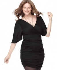 Heat up your night in Soprano's flutter sleeve plus size dress, featuring ruching throughout.